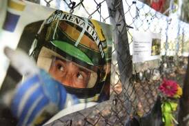 Tributes to Ayrton Senna hang on the the corner where he died at Imola in 1994. (AP PHOTO)